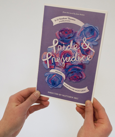 Pride & Prejudice program book cover featuring a watercolor illustration of purple flowers and purple ribbon