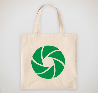 Frame Your Story logo mark printed on a canvas tote bag